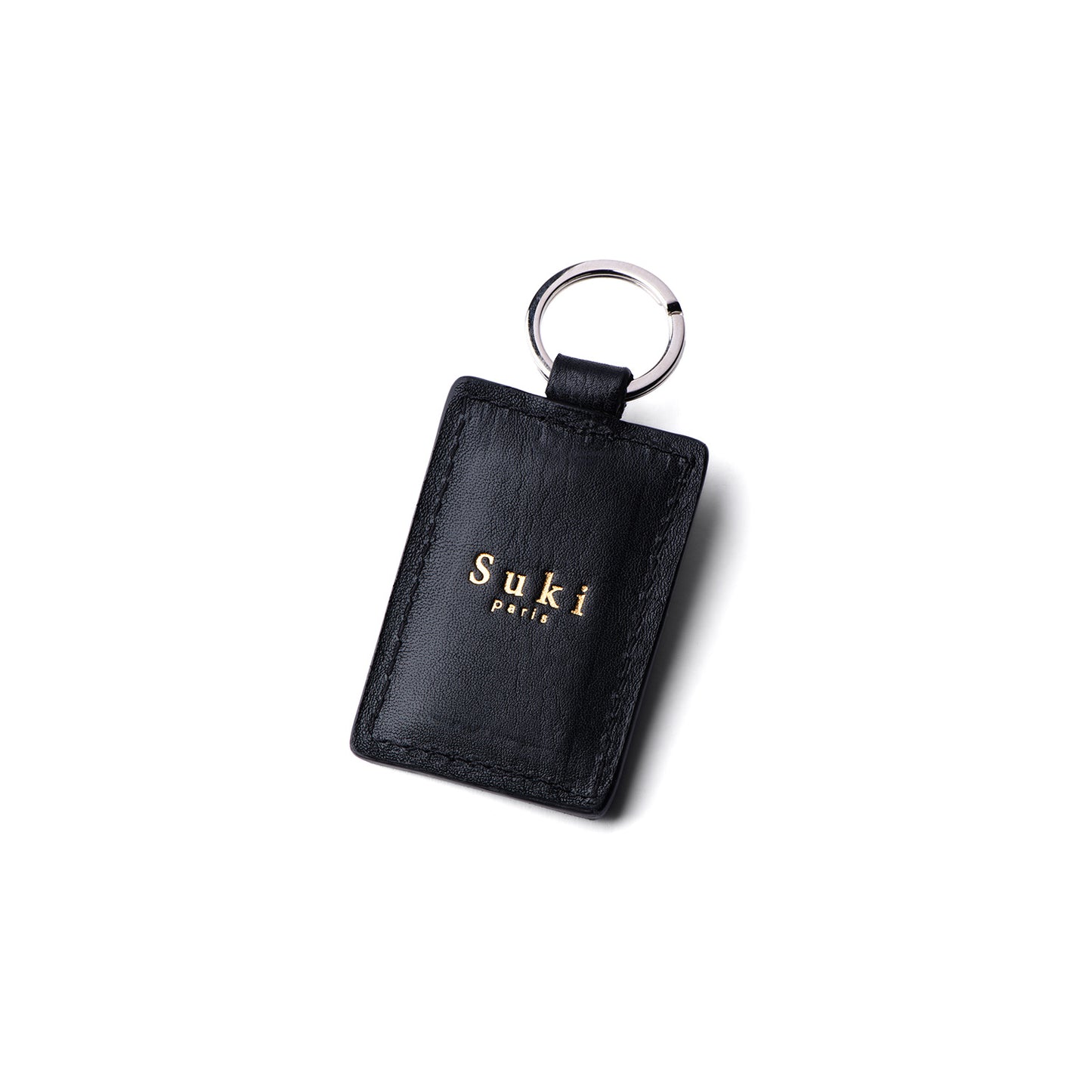 Détail personnalisation porte-clé cœur cuir — marquage à chaud